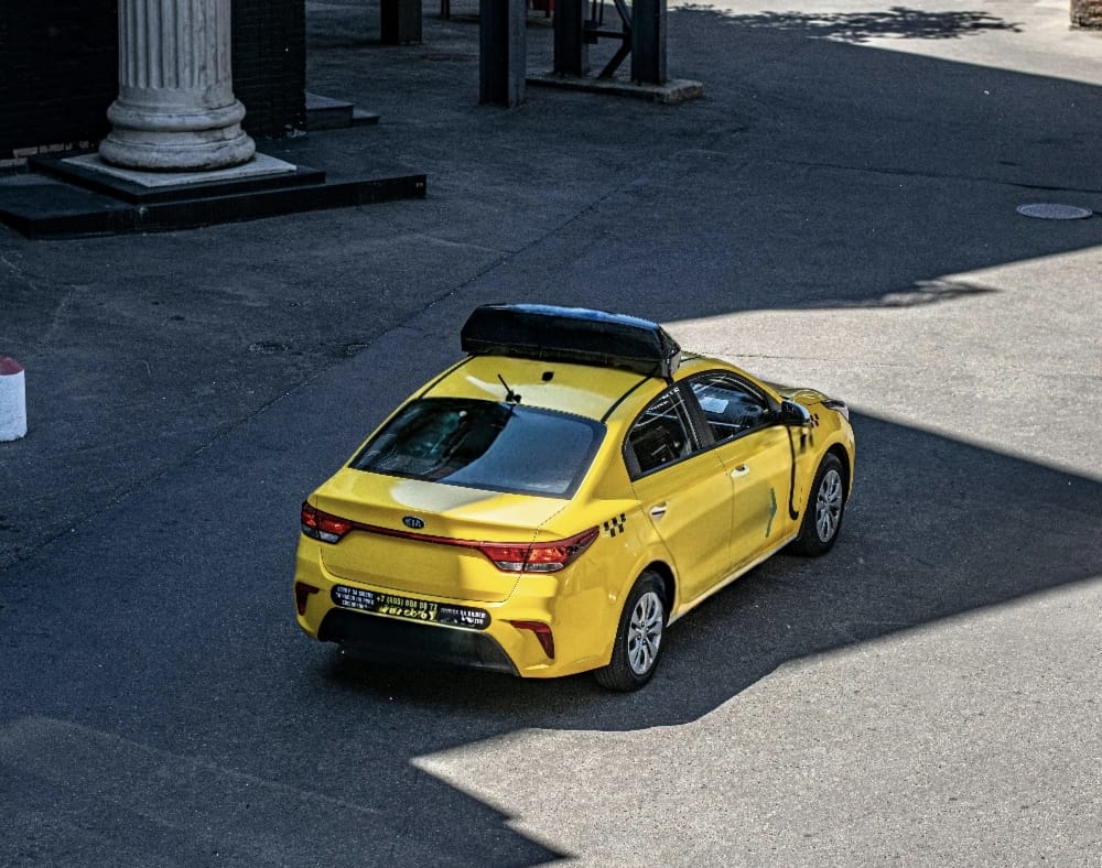 Person using a mobile app to book an auto ride